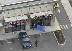 An aerial view shows the scene at Forza Coffee Company near Parkland on Sunday after four Lakewood police officers were shot dead in what authorities call an ambush. 