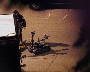Police prepare a robot during the standoff in Seattle's Leschi neighborhood Monday, Nov. 30, 2009. 