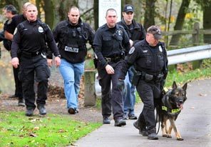 Seattle Police search Rizal Park between 12th Avenue South and Interstate 5 today for the suspect who shot and killed four Lakewood Police officers on Sunday.