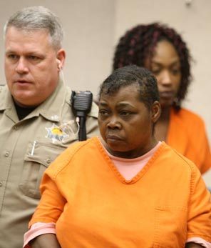Maurice Clemmons' aunt Letricia Nelson, 52, was charged with possession of one of the officers' handguns. 