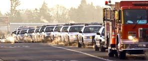 Police and fire vehicles line-up along 112th Street SW headed to McChord Air Force Base early Tuesday morning for the memorial procession for the four slain Lakewood Police Officers.