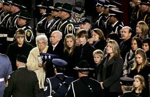 Members of Officer Greg Richards' family watch police officers file out at the conclusion of the memorial.