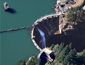 Glines Canyon is a 210-foot-tall concrete high-arch dam. It will be taken down bit by bit beginning this month. Completed in 1927, it is the upper of two dams on the Elwha, at river mile 13. Like Elwha Dam, it was built without fish passage. 