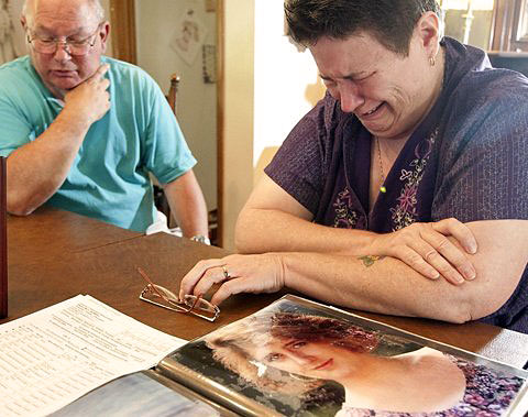 Sara Taylor, mother of former King County 911 dispatcher Angeline Burrell, describes her daughter's battle with disabling chronic pain and her overdose death from methadone. At left is Taylor's husband, Dale.