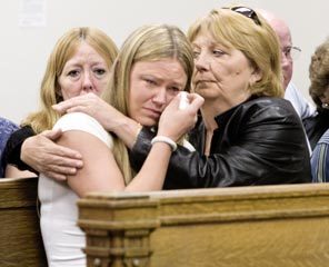 Deborah Byars, left, was killed in her home in Northeast Seattle's Bryant neighborhood. Above, Byars' daughter, Stephanie McAfee, wipes her eyes, consoled by Byars' sister Nanci Newhall during Curtis Thompson's sentencing. He is now serving five life sentences. 
