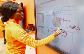  Irvina Moody demonstrates a touch screen Tuesday at the Microsoft Office 2013 launch event in New York City. 