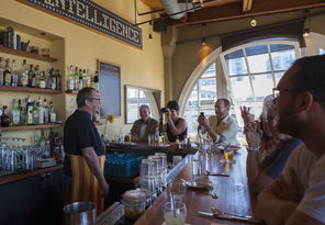 Guests enjoy a laugh with bartender Robbie McGrath at Matt’s in the Market. Tucked inside Pike Place Market, the restaurant is known for its seafood offerings and killer view of the Market’s neon sign. 