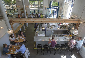 Left: James Beard Award-winner Matt Dillon’s polished Bar Sajor in Pioneer Square.  The kitchen features a wood-fired oven, rotisserie and grill. 
