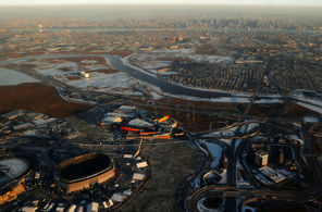 This aerial photo shows MetLife Stadium, lower left, in East Rutherford, N.J., with the New York City skyline, top, not that far away in the background across cold marshlands. 