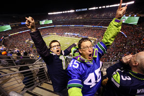 Seahawk fans at the game react to a play during the first half. By the end of the game, Seattle fans were ecstatic. “I was hugging people I don’t even know,” said Jim Weber of Kirkland.