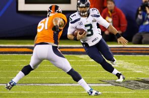 Seahawks quarterback Russell Wilson (3) scrambles against Broncos linebacker Paris Lenon (51) during the second half. Wilson rushed for 26 yards on three carries.