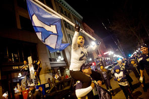 Thousands of Seahawk fans whoop it up Sunday night while celebrating Seattle’s Super Bowl victory in Pioneer Square.
