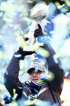 Seahawks owner Paul Allen hoists the Lombardi Trophy during the Super Bowl XLVIII victory fan rally at CenturyLink Field on Wednesday. Seattle beat the Broncos 43-18 to win the title — eight years after losing to the Steelers in the big game.