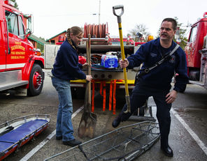Volunteer firefighters Jessica Nemnich, left, and Eric Finzimer in Darrington on Sunday.