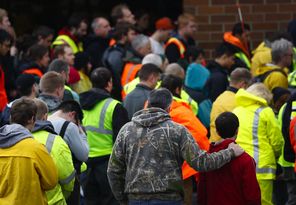 Volunteers in Oso bow their heads for a moment of silence at 10:37 a.m. Saturday, exactly a week after the deadly mudslide. Meanwhile, search efforts now include specialists looking for chemical contaminants in the slide area. 