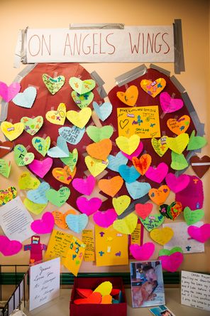 Heart-shaped cards with messages of love, loss and hope for the victims and communities affected by the massive mudslide decorate a broken-heart-shaped paperboard at the IGA supermarket in Darrington in April.