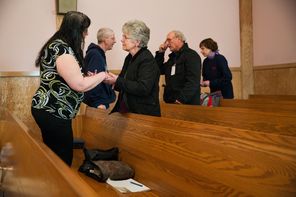 Congregants of Darrington’s First Baptist Church exchange greetings during Sunday service April 6. The slide closed a stretch of Highway 530 for weeks, making it difficult for worshippers from Arlington to go to church. Some drove four hours round trip to attend Easter services, the church’s first post-slide service as a community.